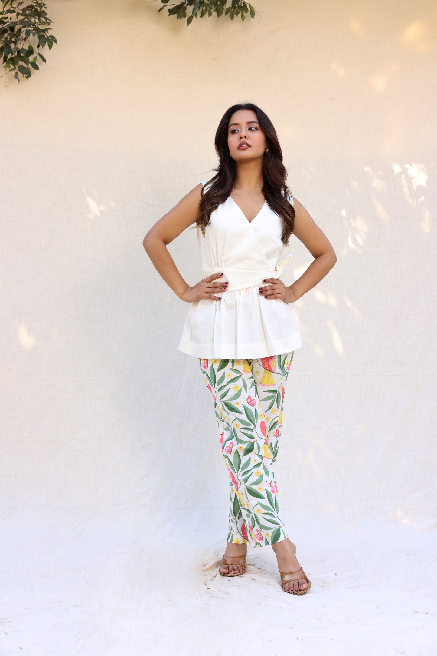 Sleeveless peplum top with tie knot belt with printed pants set