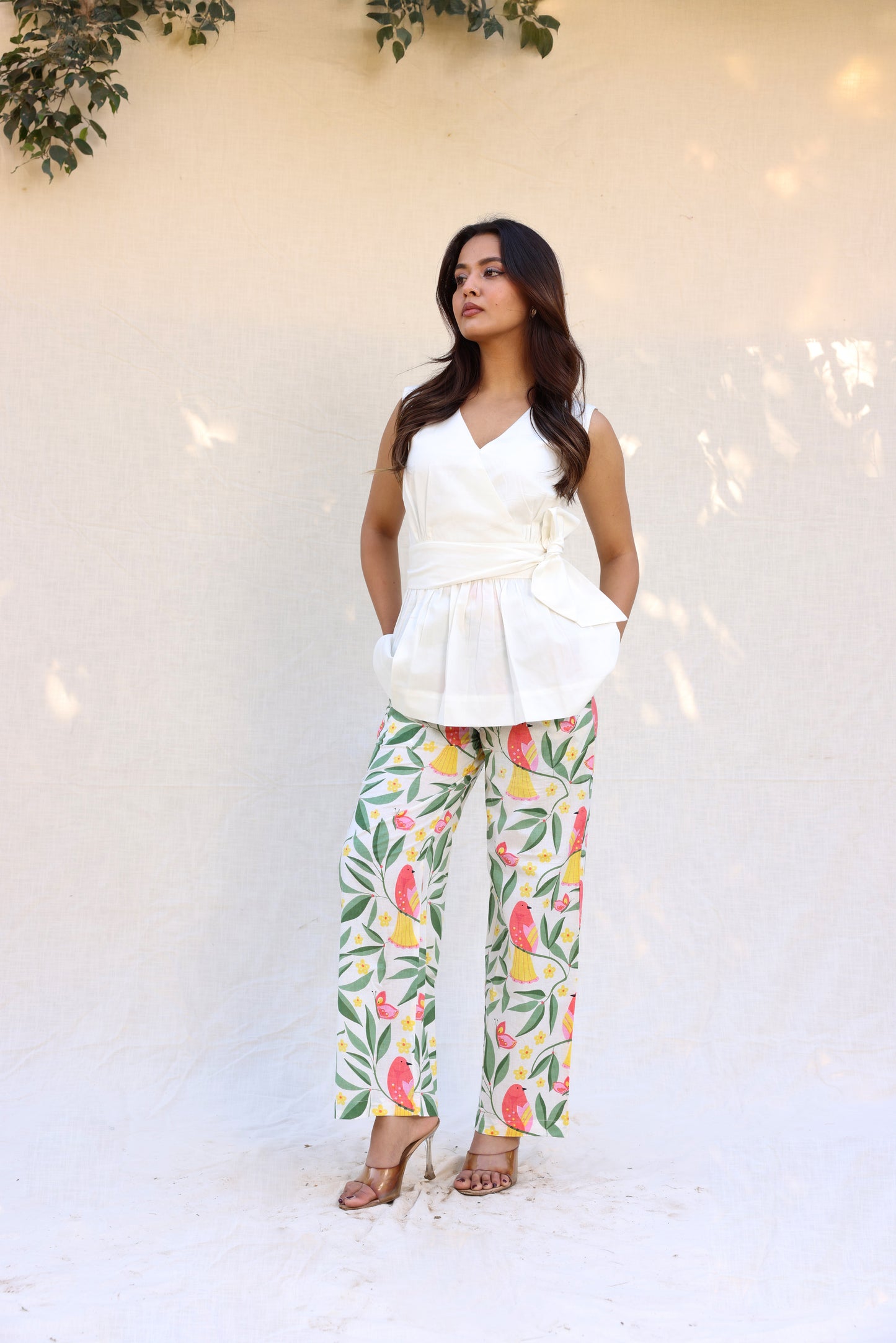 Sleeveless peplum top with tie knot belt with printed pants set