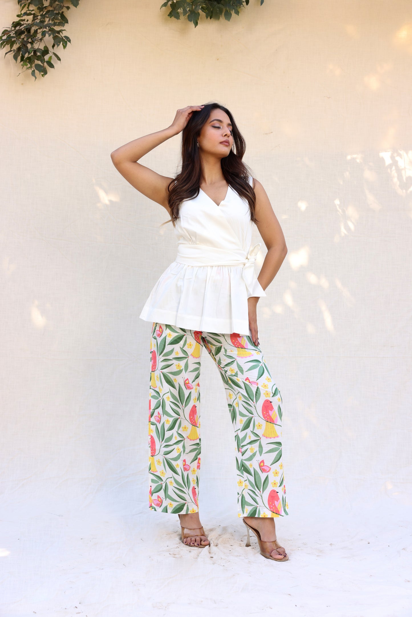 Sleeveless peplum top with tie knot belt with printed pants set