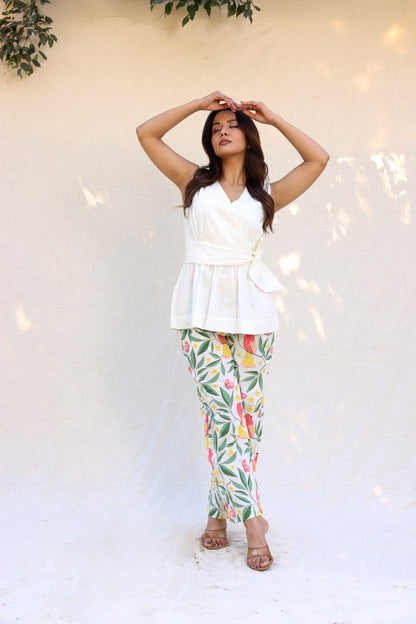 Sleeveless peplum top with tie knot belt with printed pants set