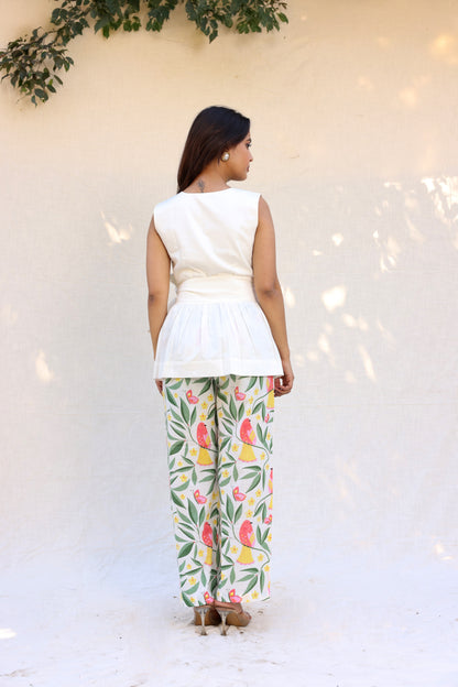 Sleeveless peplum top with tie knot belt with printed pants set